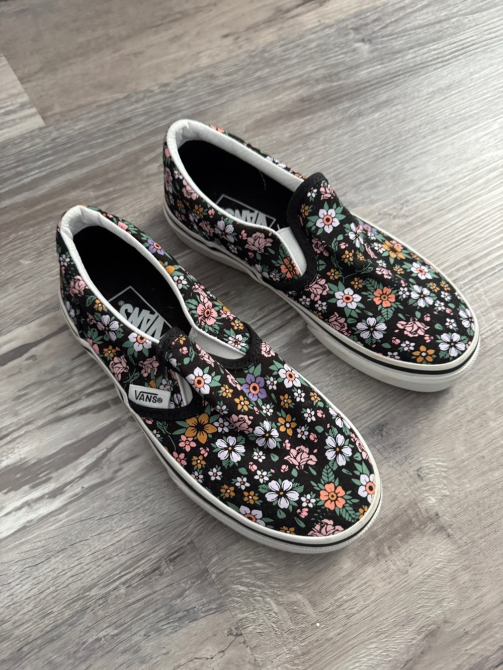 Vans Kids Floral Slip-On Sneakers in Black with Pink, White & Orange Flowers